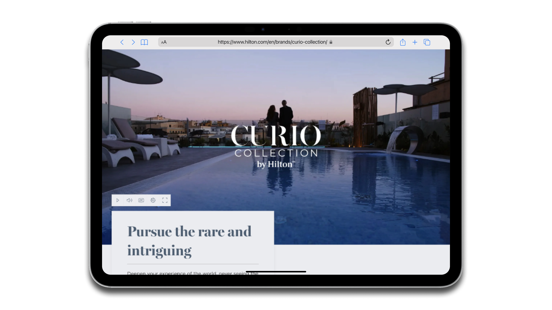 A tablet device showing the larger view of the accessible video player on a hotel brand home page.